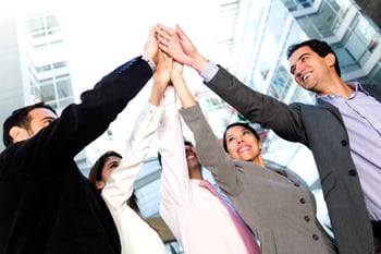Successful business people celebrating with a high-five