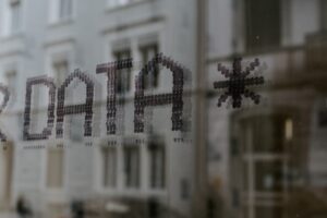 black and white photo of the words "data" on glass