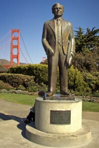 memorial statue of Joseph Strauss, chief engineer of the Golden Gate Bridge with Golden Gate Bridge in background