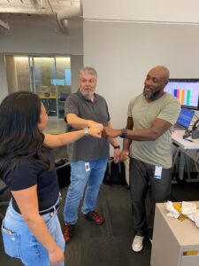 Beck Tech team members fist bump