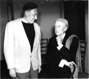 Bruce Goff standing with Frank Lloyd Wright