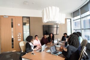 black women sitting at a table with computers