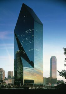 a beautiful pointed skyscraper in the evening