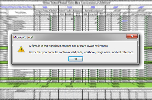 An Excel error message pop-up reading “A formula in this worksheet contains one or more invalid references. Verify that your formulas contain a valid path, workbook, range name, and cell reference” with a spreadsheet in the background.