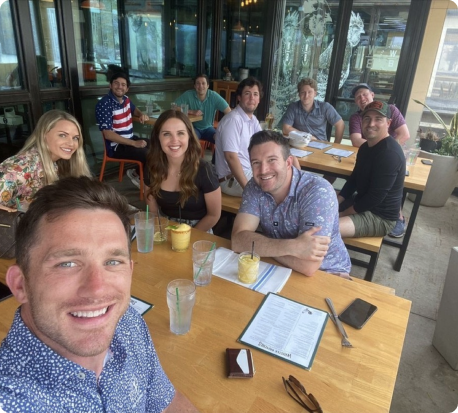 Ten members of the Beck team out at a restaurant together.