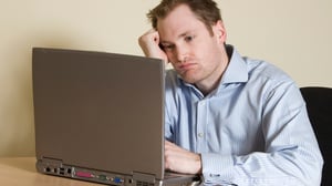 confused man at laptop